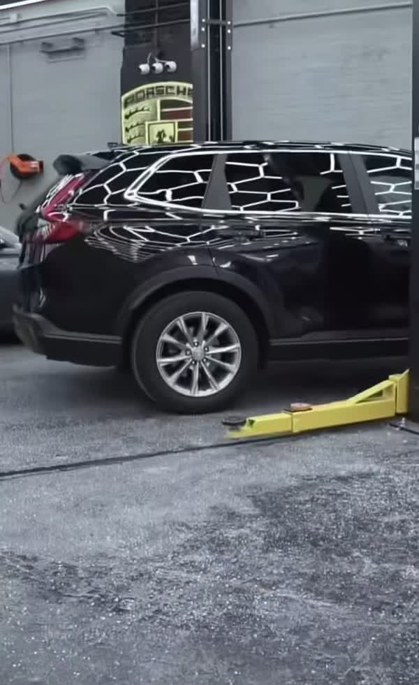 SUV with bodywork primer on its panels at ENY Automotive
