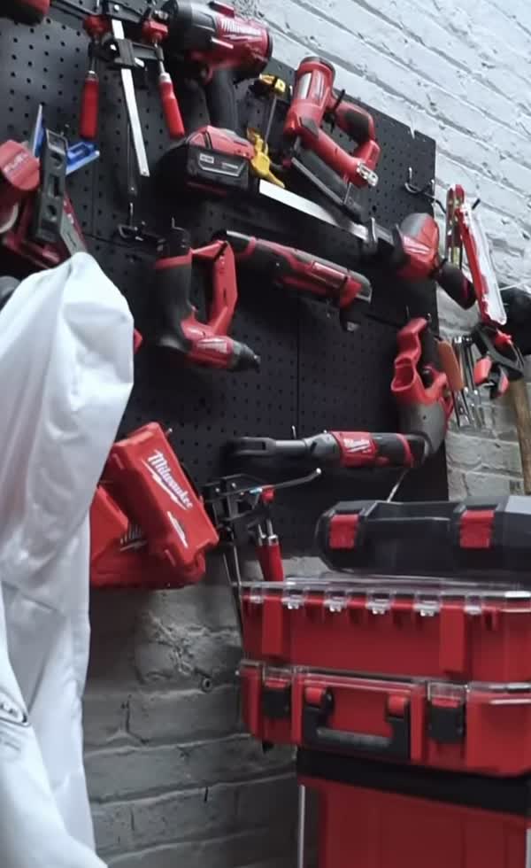 Wall of professional-grade power tools at ENY Automotive